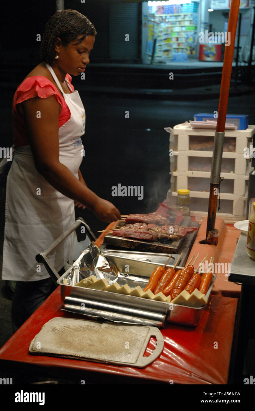 Painet iy8146 woman female brazil niara darc cooking kebabs sausages food stall rio janeiro 2005 country developing nation Stock Photo