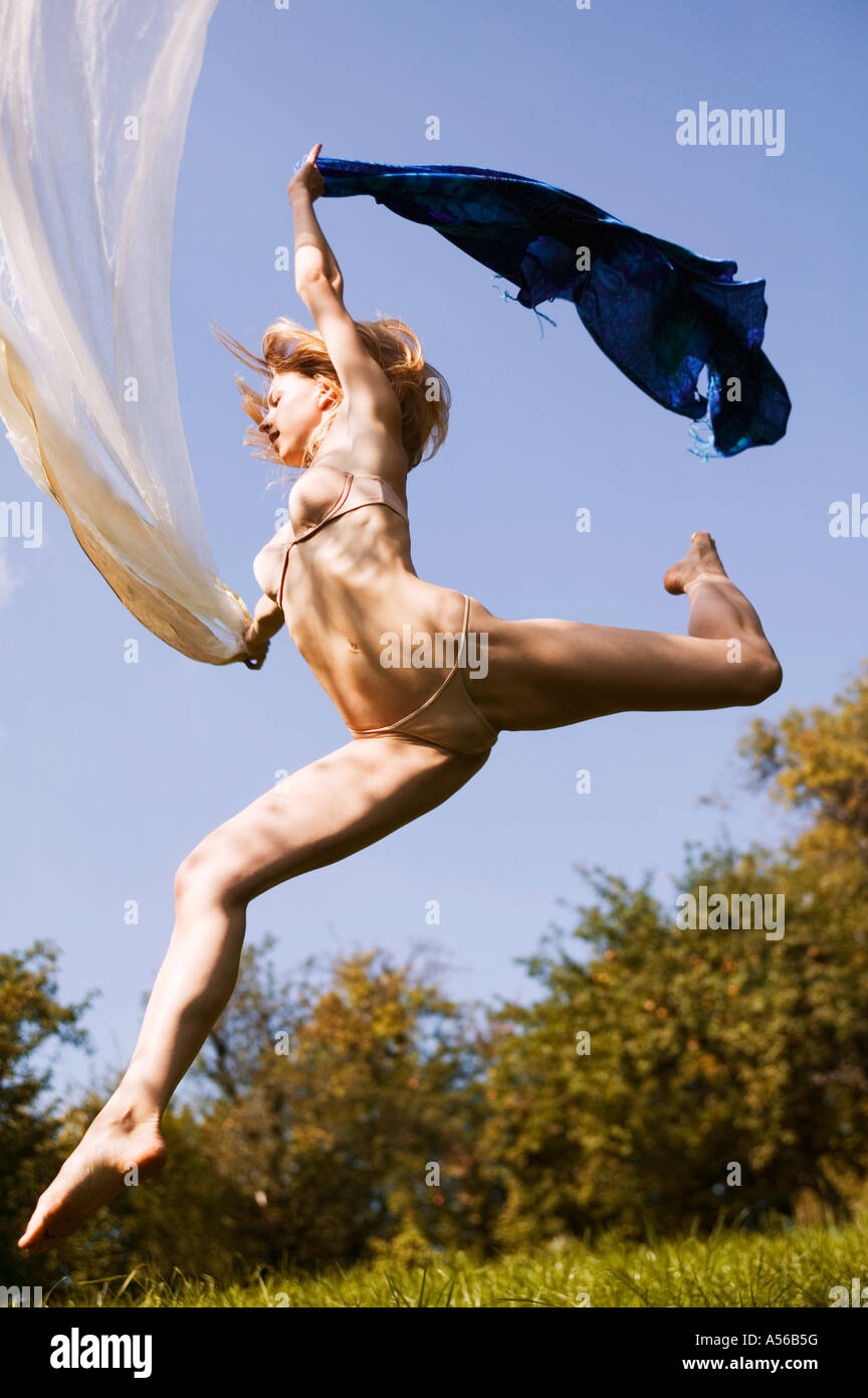 Young nude woman in mid-air Stock Photo - Alamy