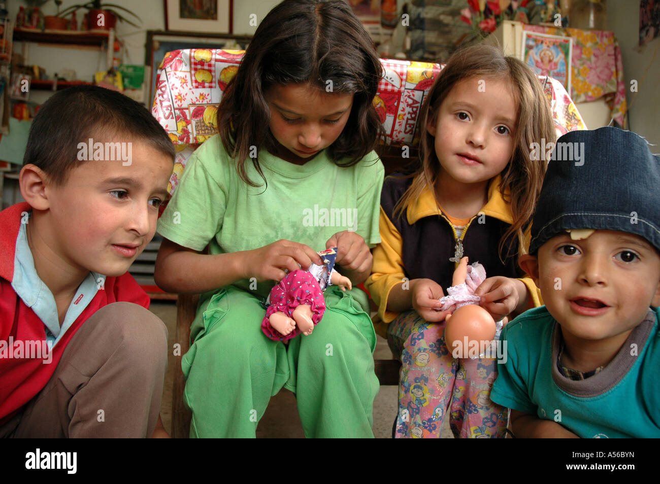 Painet iy8310 children kids colombia sisters playing dolls slum altos cazuca bogota photo 2005 country developing nation Stock Photo