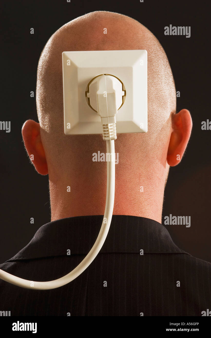 Man with plug and socket on back of head Stock Photo - Alamy