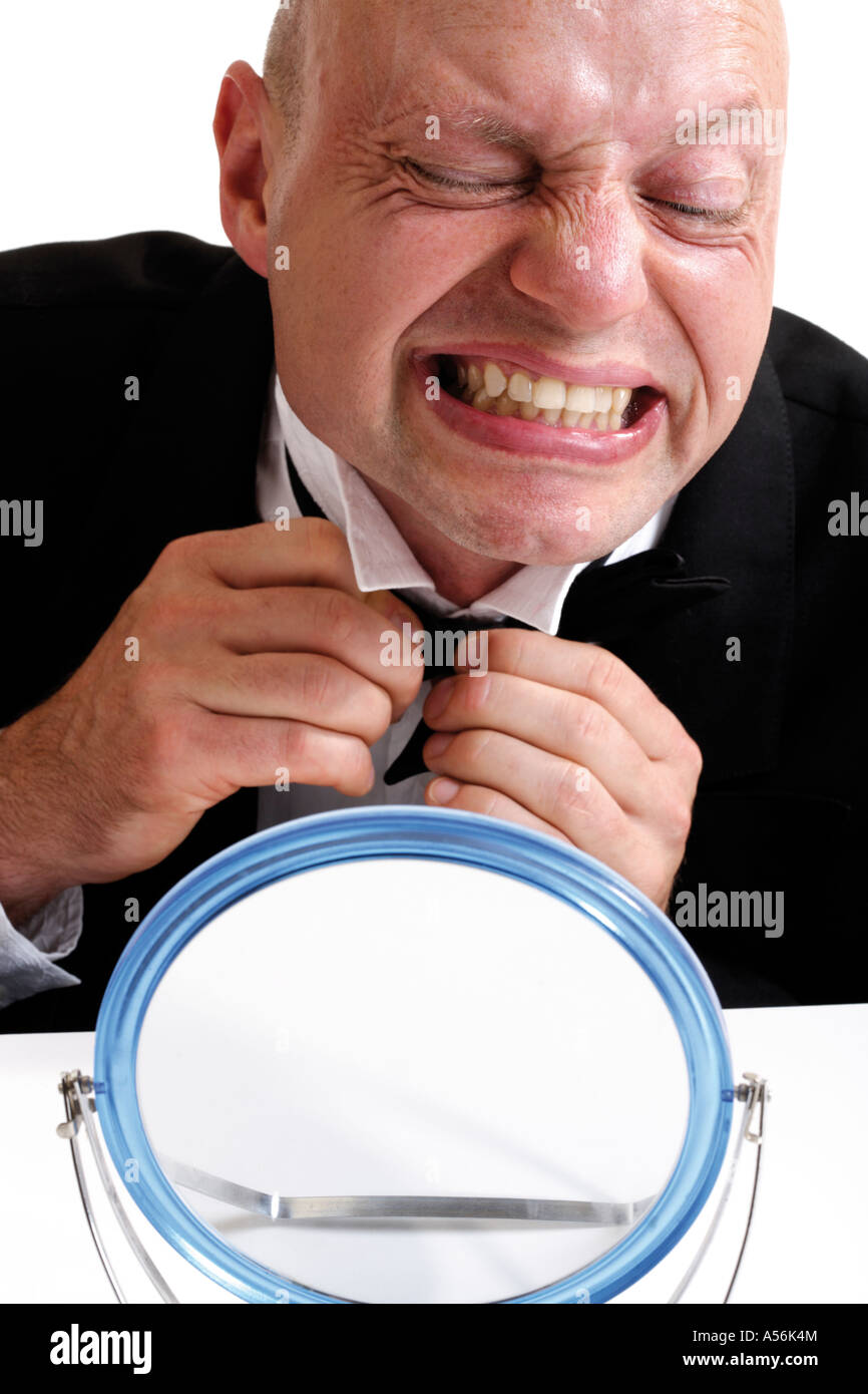 Man binding tie, portrait Stock Photo