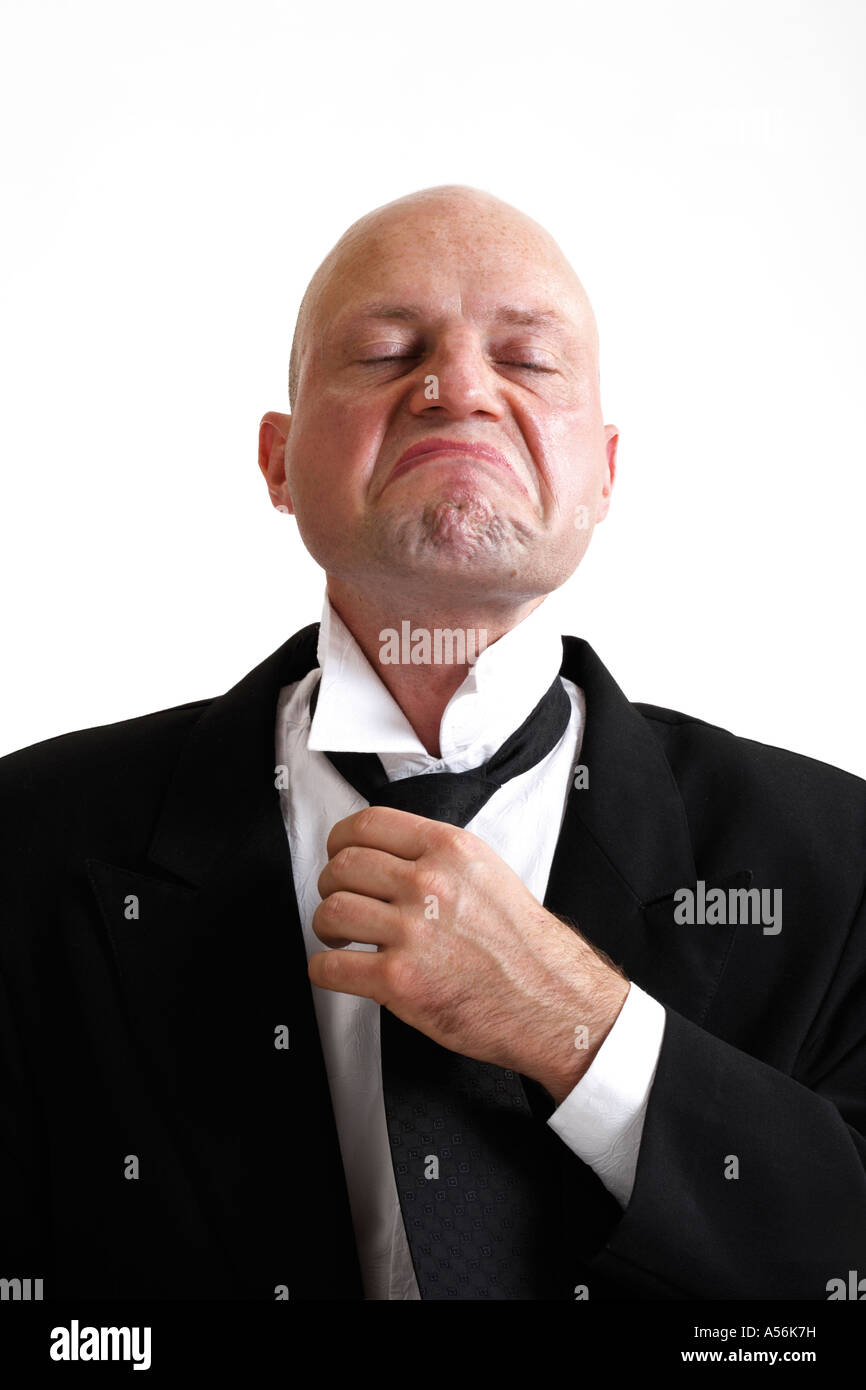 Man binding tie, portrait Stock Photo