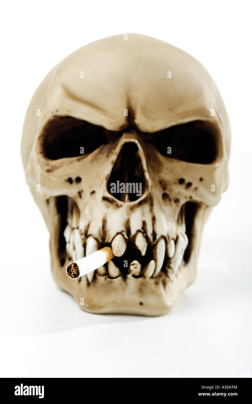 Skull with cigarette Stock Photo