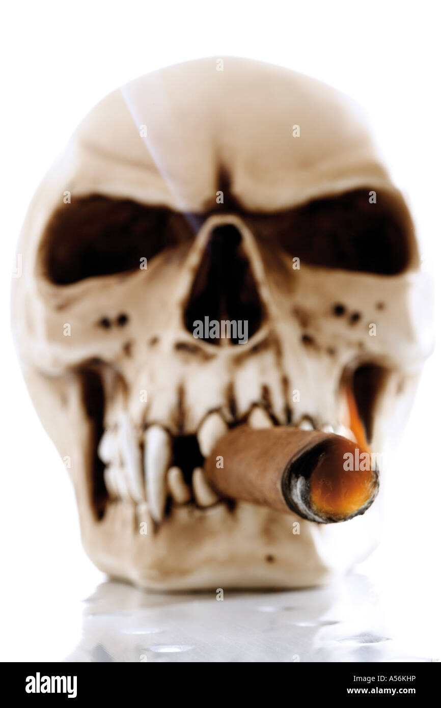 Skull with burning cigarette look alike Stock Photo