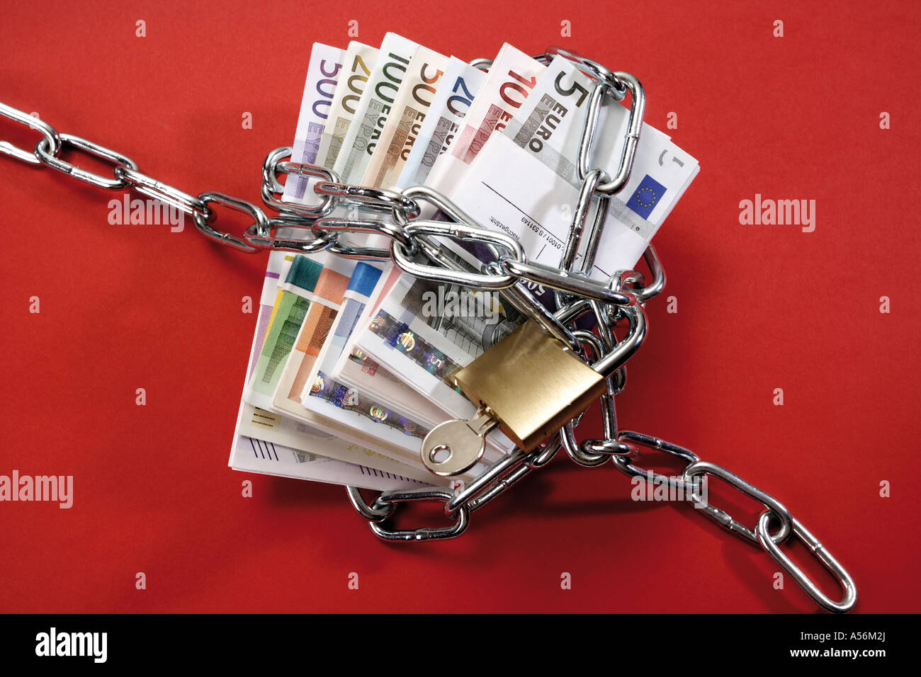 Bunches of Euro banknotes in chains Stock Photo - Alamy