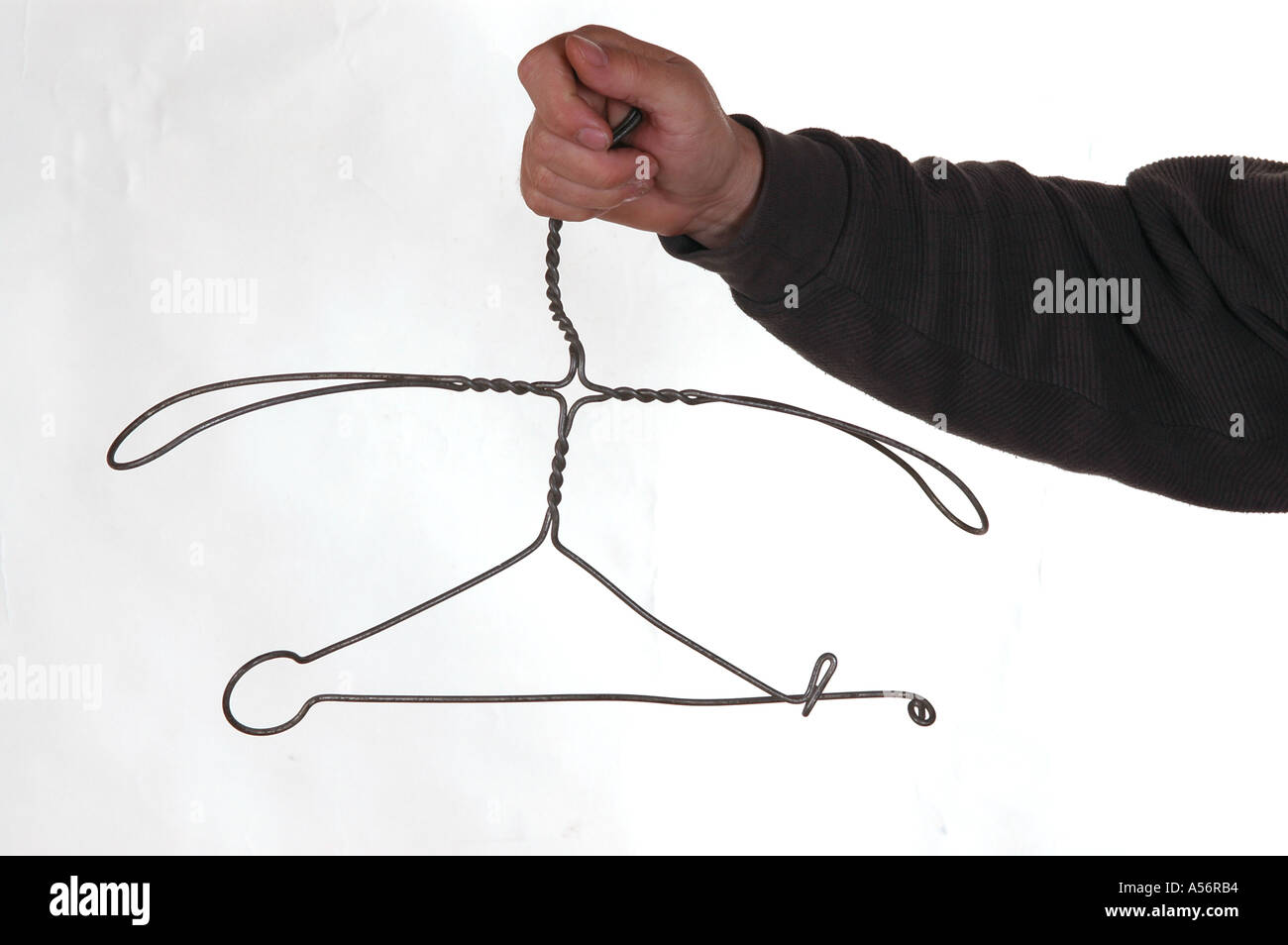 Man hand with wire hanger Stock Photo