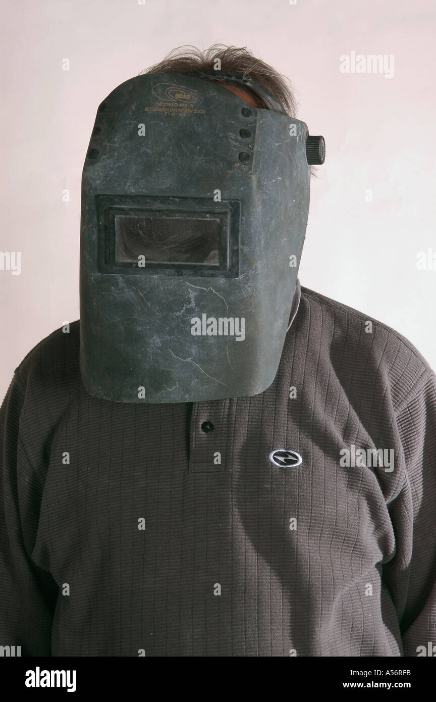 Man head wearing a welders mask close up Stock Photo Alamy