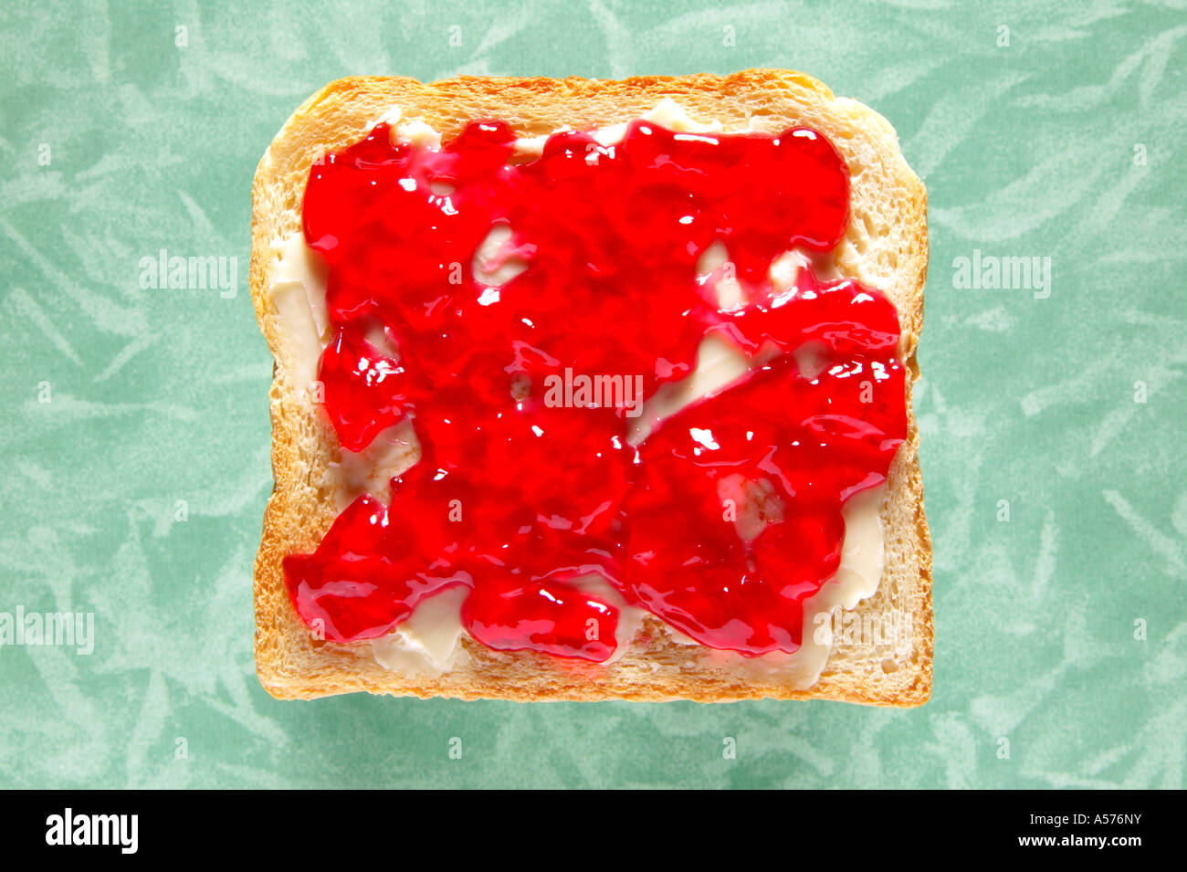 Slice of toast with jelly, close-up, elevated view Stock Photo