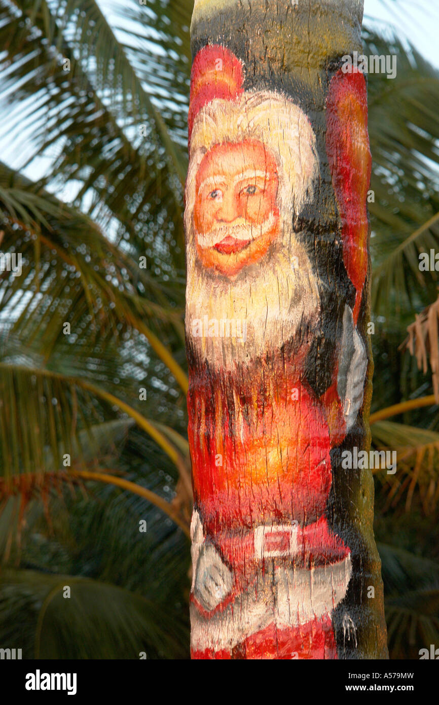 Painet jc3076 india santa claus father christmas painted coconut tree varkala beach resort kerala tourism tourist holiday Stock Photo
