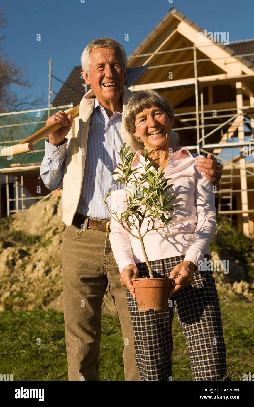 Senior couple gardening, smiling, portrait, low angle view Stock Photo ...