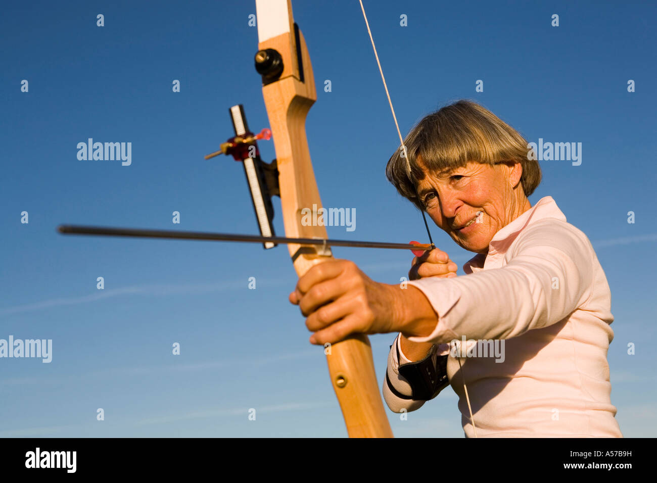 Woman bow arrow heart hi-res stock photography and images - Alamy