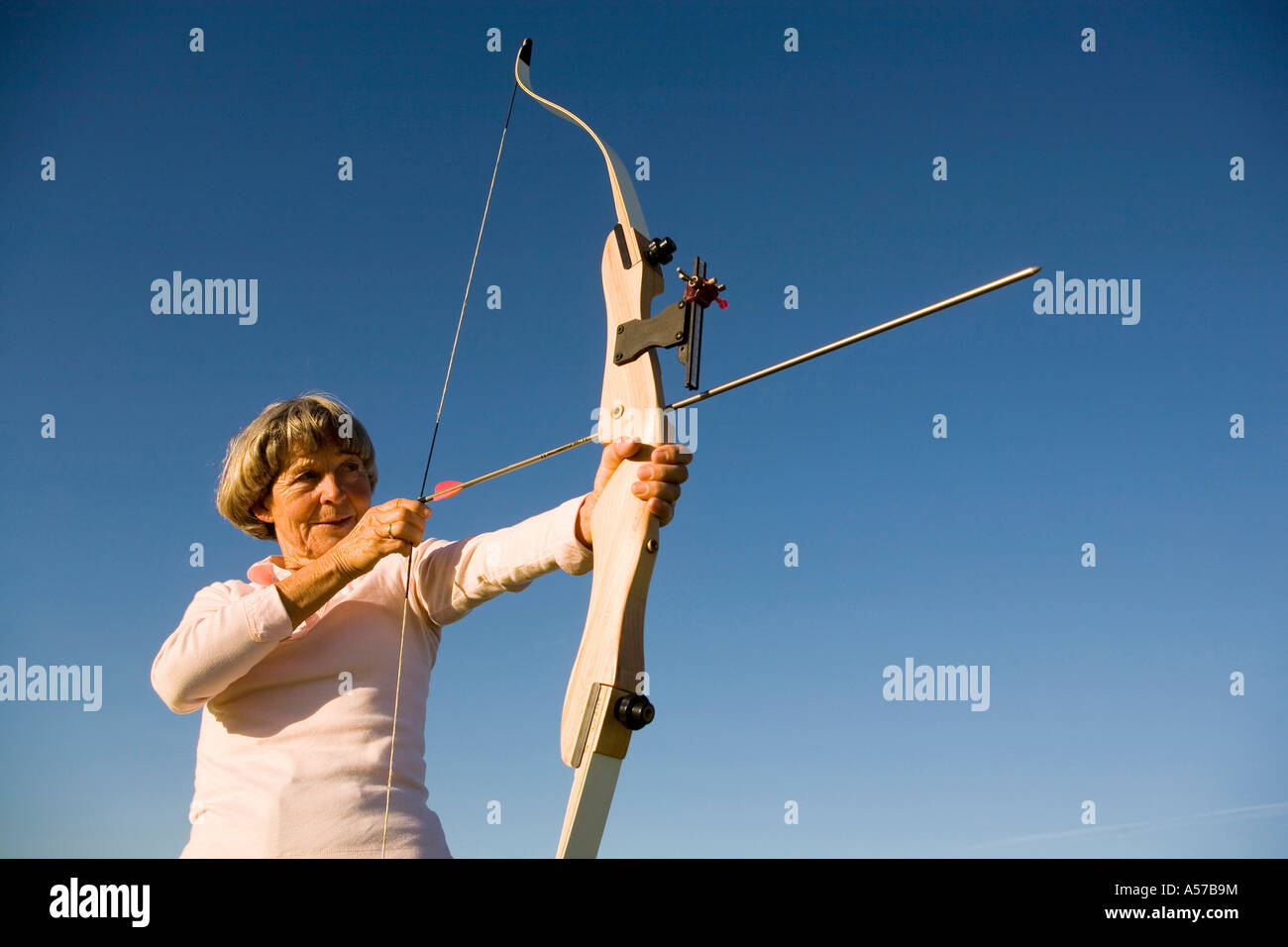 Woman bow arrow heart hi-res stock photography and images - Alamy