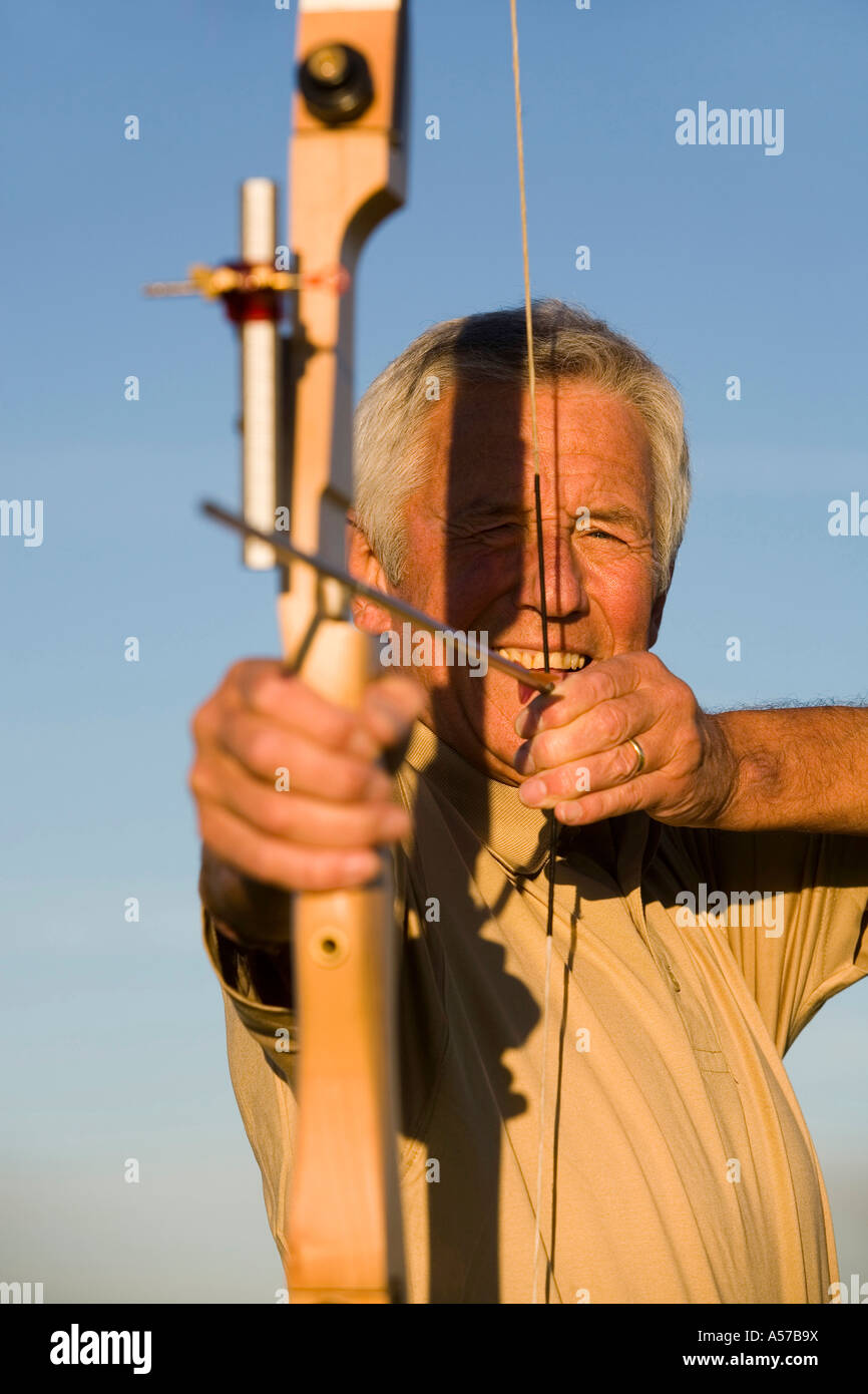 Woman using bow and arrow hi-res stock photography and images - Alamy