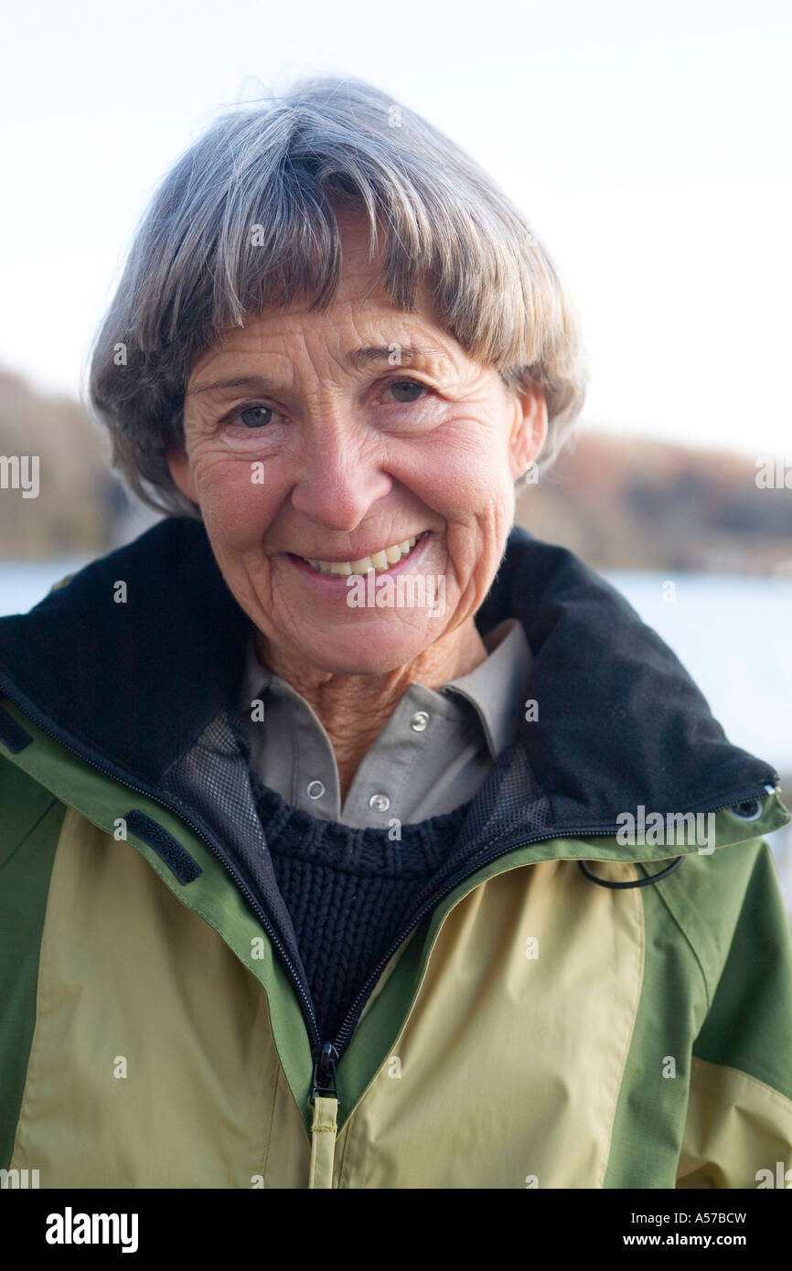 Senior woman smile dark hair hi-res stock photography and images - Alamy