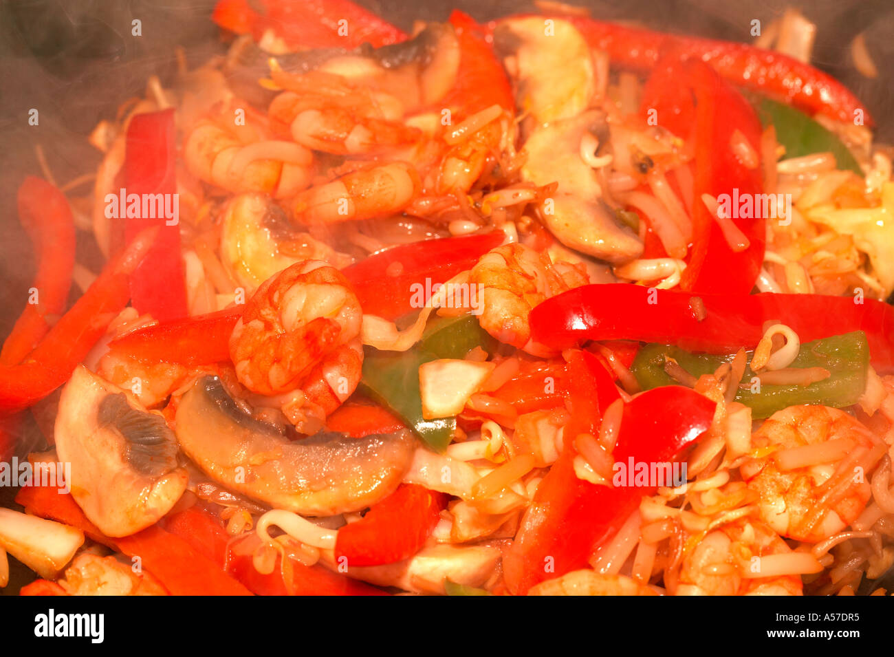 stir frying vegetables and prawns Stock Photo