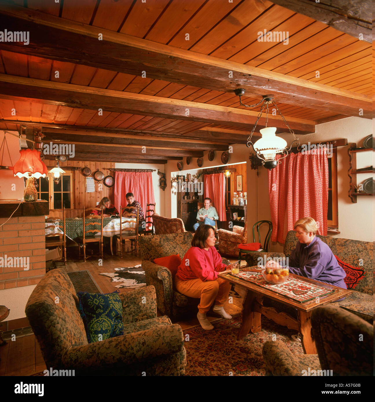 Interior of a traditiional swiss chalet  in the evening, Les Diablerets, Swiss Alps, Switzerland Stock Photo