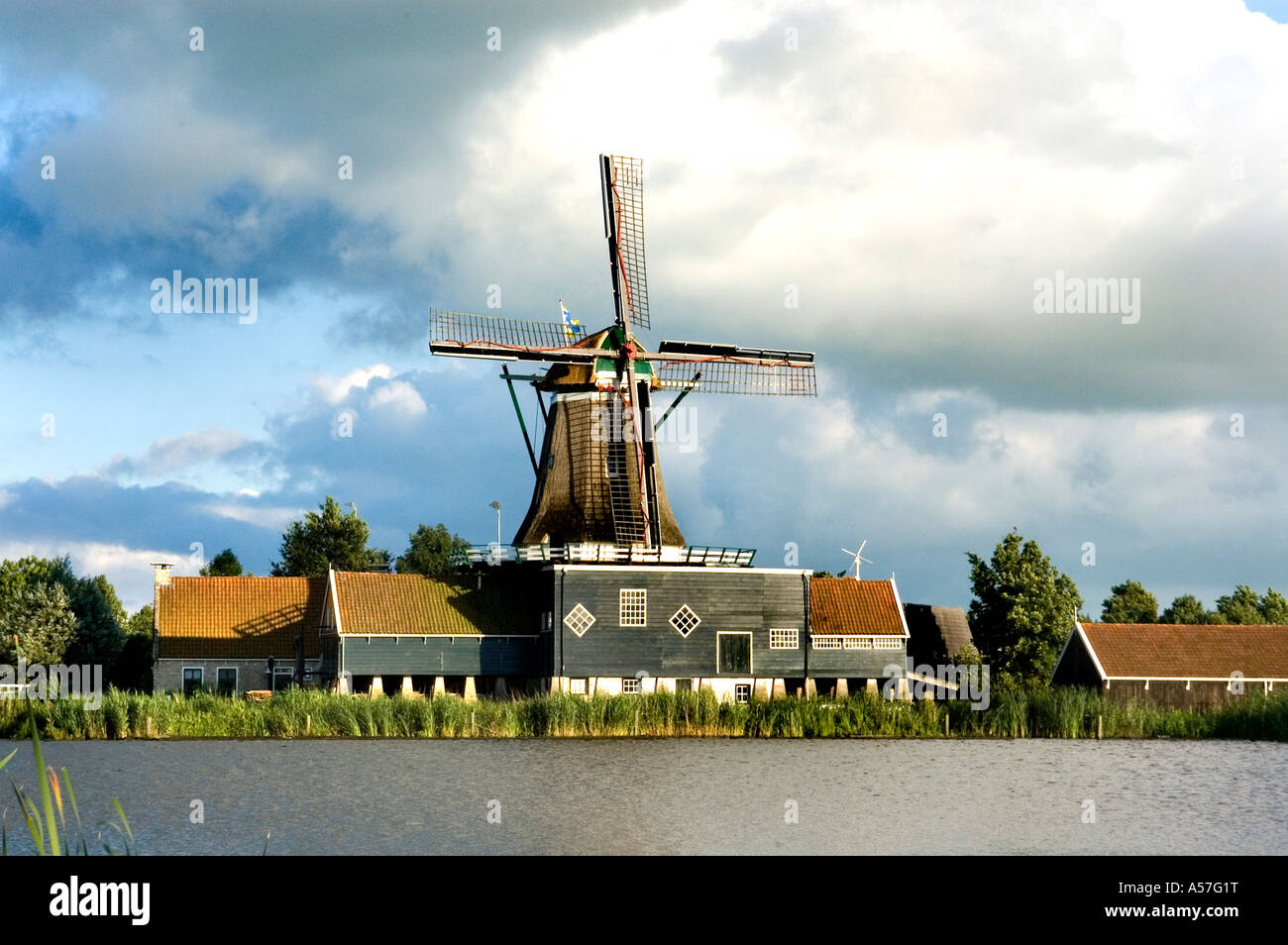 People gathered around a fire at a Friesland windmill event