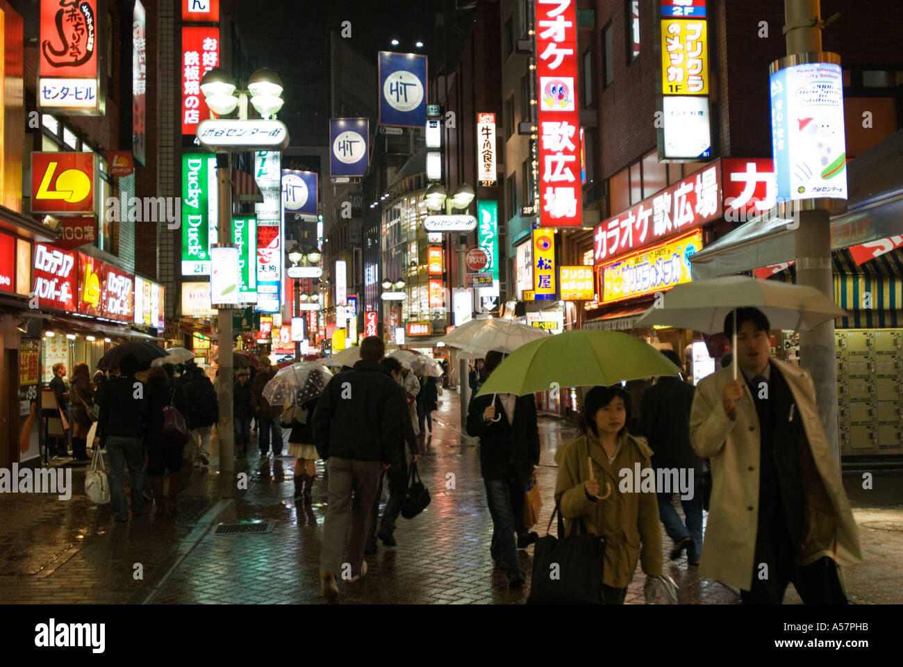 Busy street at night in Shibuya entertainment and shopping district Tokyo Japan 2006 Stock Photo