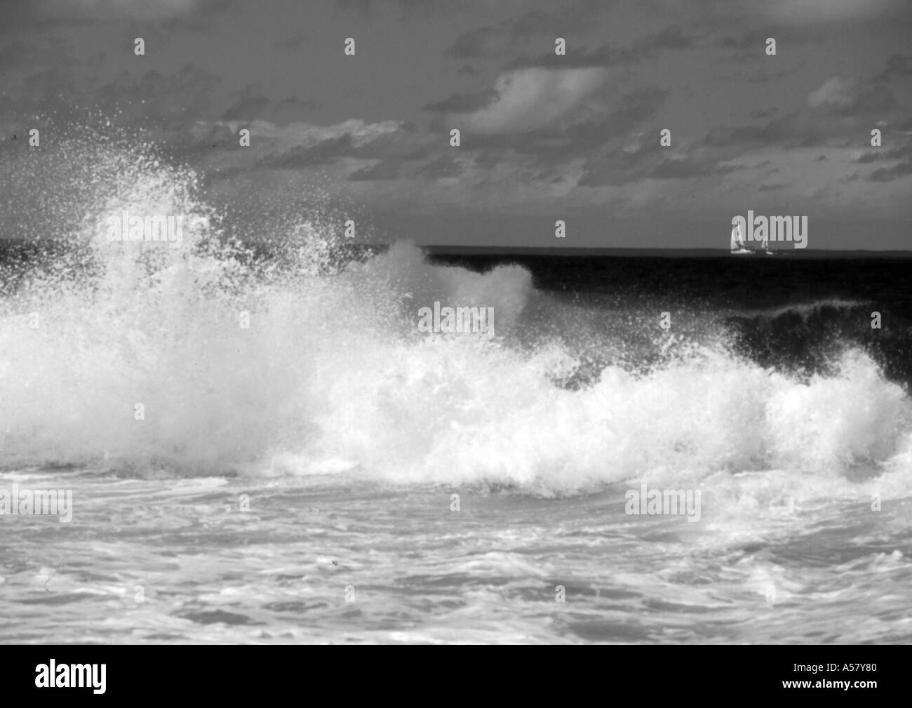 BREAKING SURF AND YACHT BOUNTY BEACH TORTOLA BRITISH VIRGIN ISLANDS Stock Photo