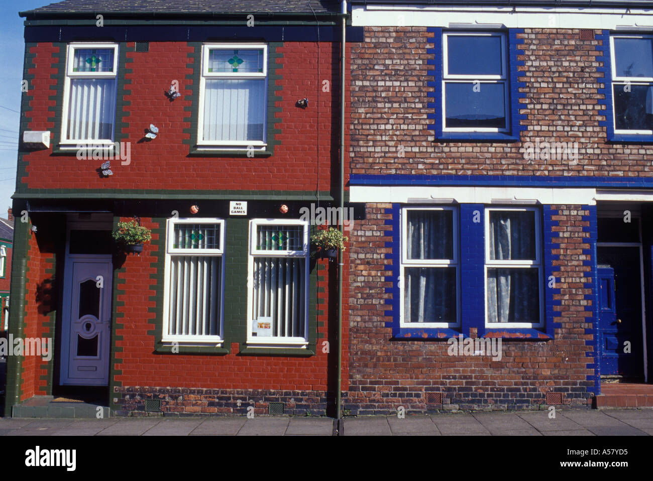 Tranmere Merseyside England Two late Victorian shipyard workers  terrace houses with modern replacement plastic windows and door Stock Photo