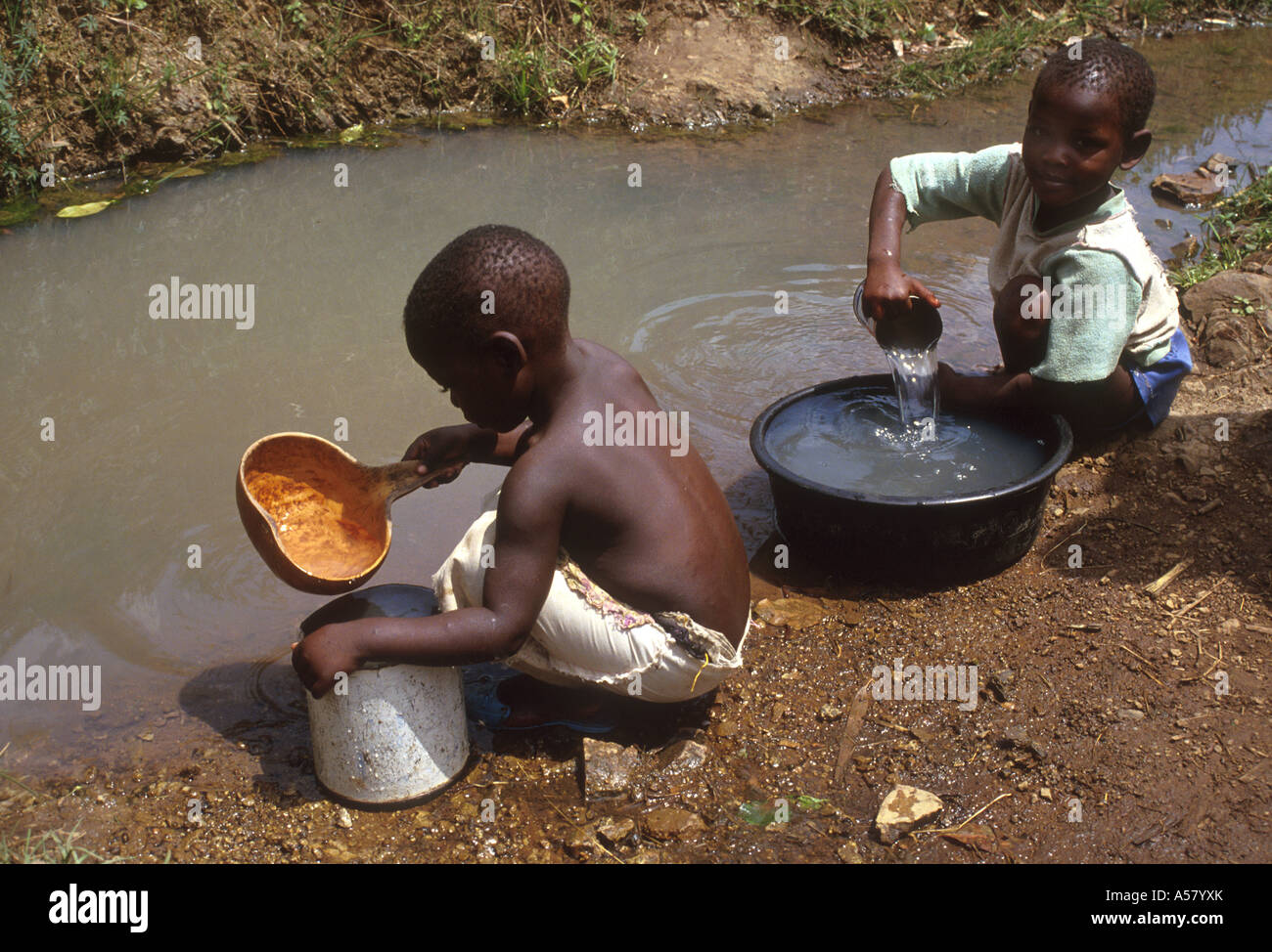 Painet ha2107 4231 kenya children boys collecting dirty drinking water stream south nyanza country developing nation less Stock Photo