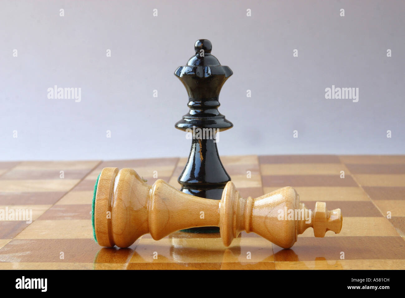 Chess, black queen, white king, mate Stock Photo - Alamy