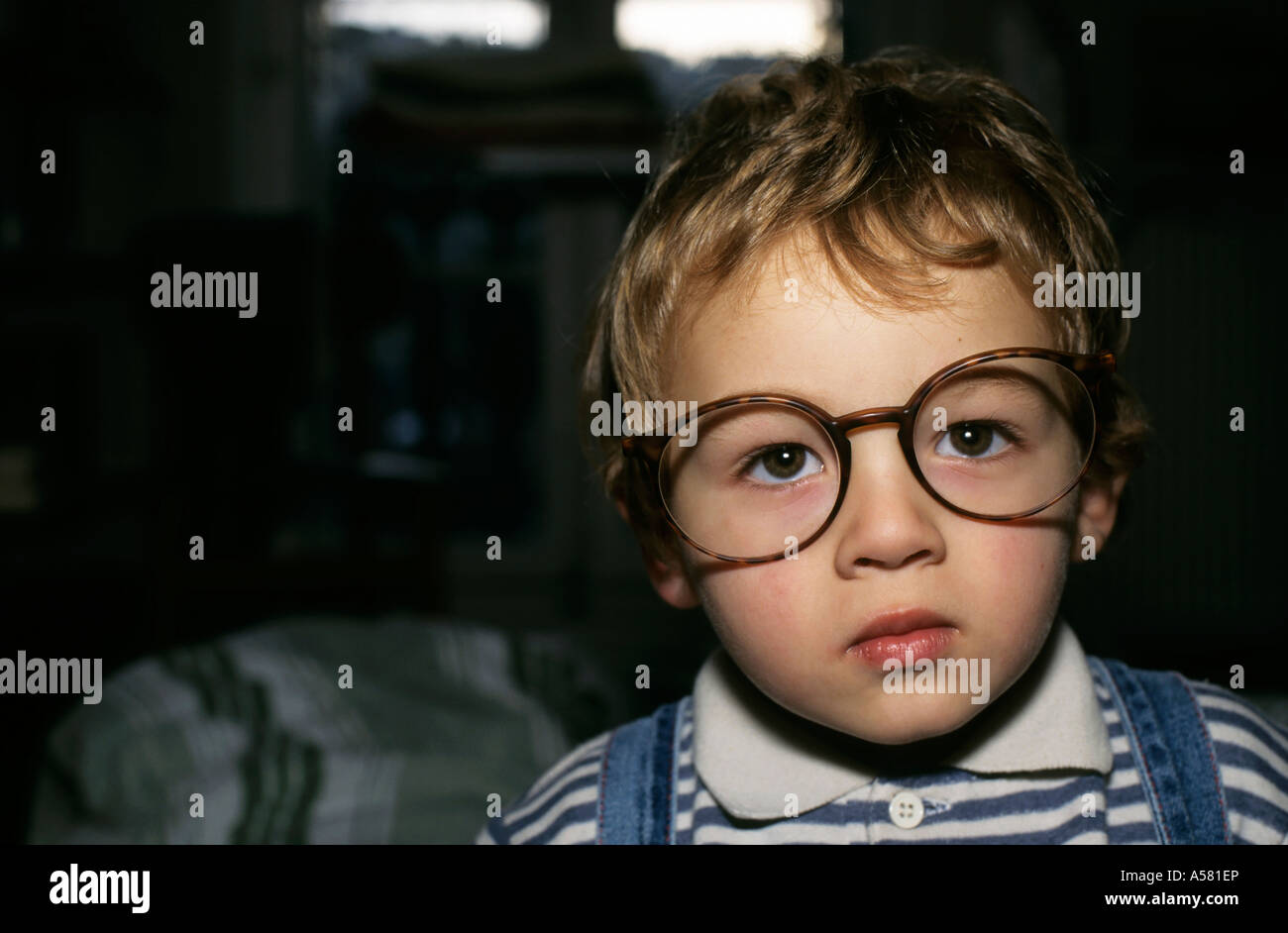 Young boy wearing oversized glasses. Stock Photo