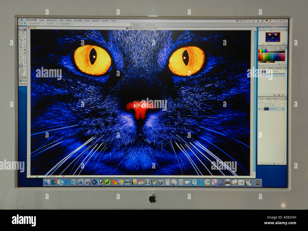 Digital composing with Adobe Photoshop on Apple Cinema Display Stock Photo