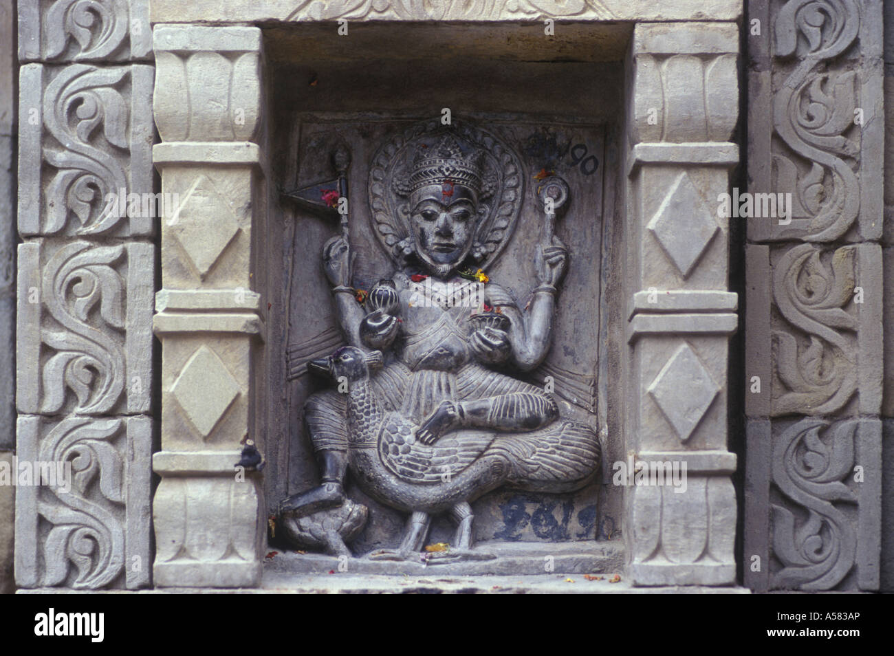Detail of the facade of one of the Chamba-Temples ( the figure shows either Skanda / Kartikeya on his vahana the peacock or Bra Stock Photo