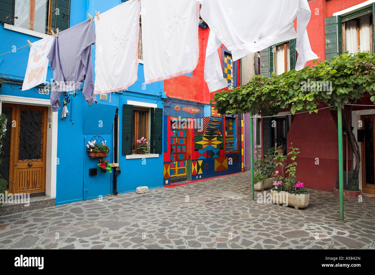 Courtyard with clothesline and colorful houses, Burano, Veneto, Italy, Europe Stock Photo