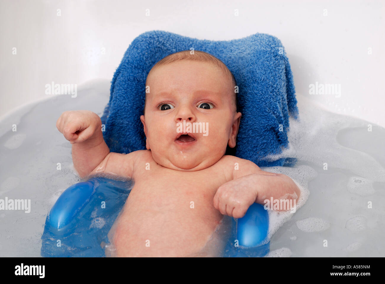 Baby (boy, two month old) lying in a bath tub Stock Photo Alamy