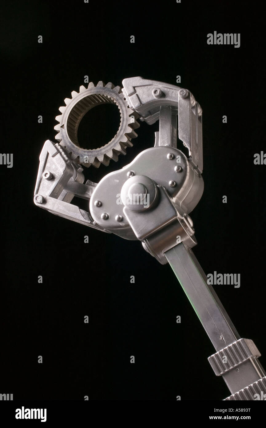 Robotic arm holding gear Stock Photo