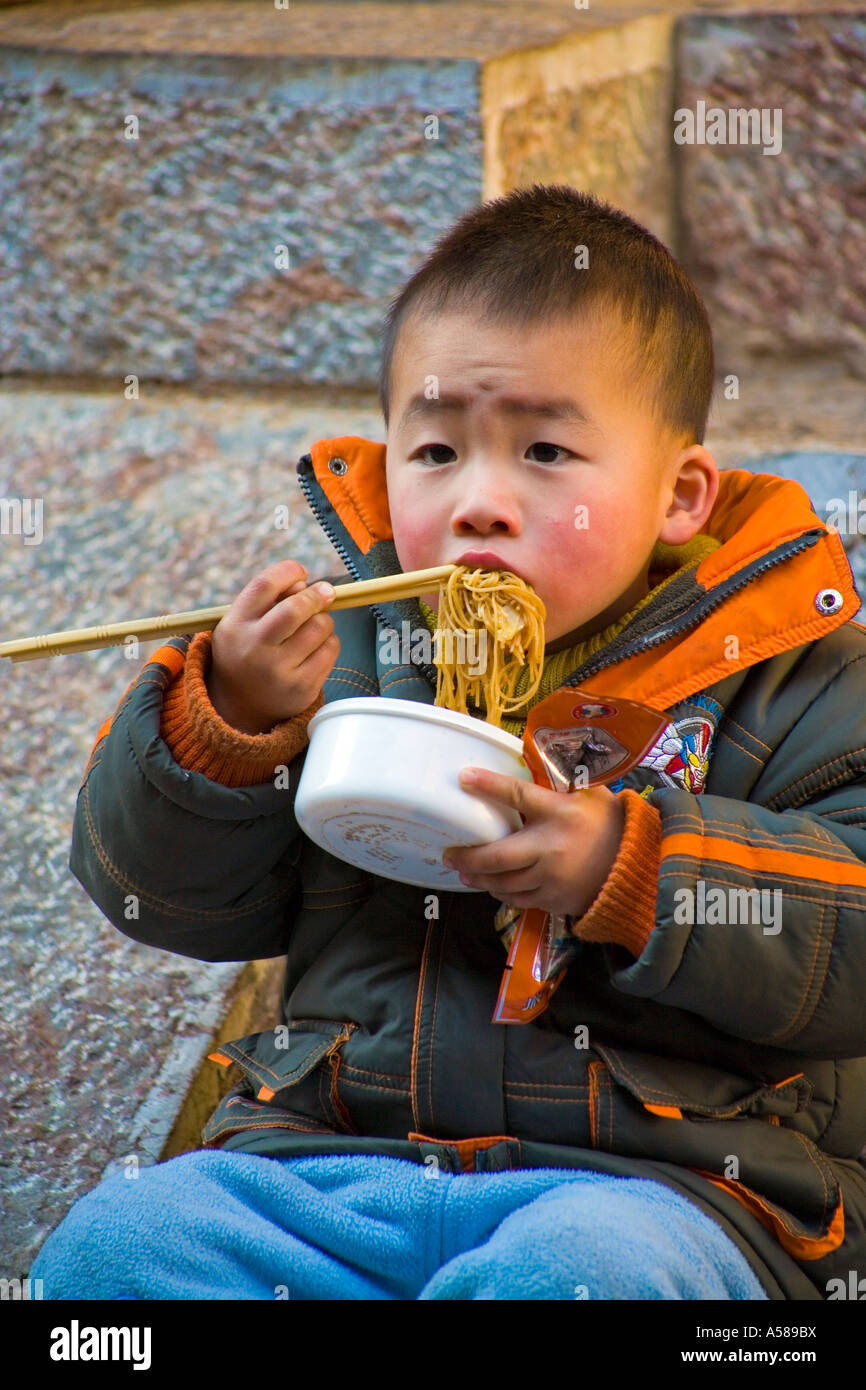 China boy eating chopsticks hires stock photography and images Alamy