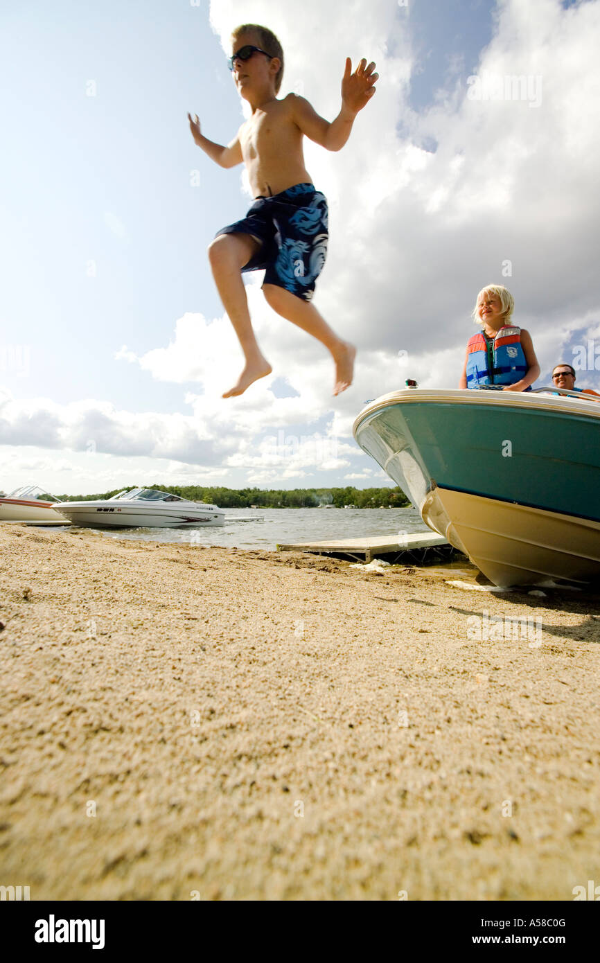 Boy Jumping Boat Stock Photos & Boy Jumping Boat Stock Images Alamy