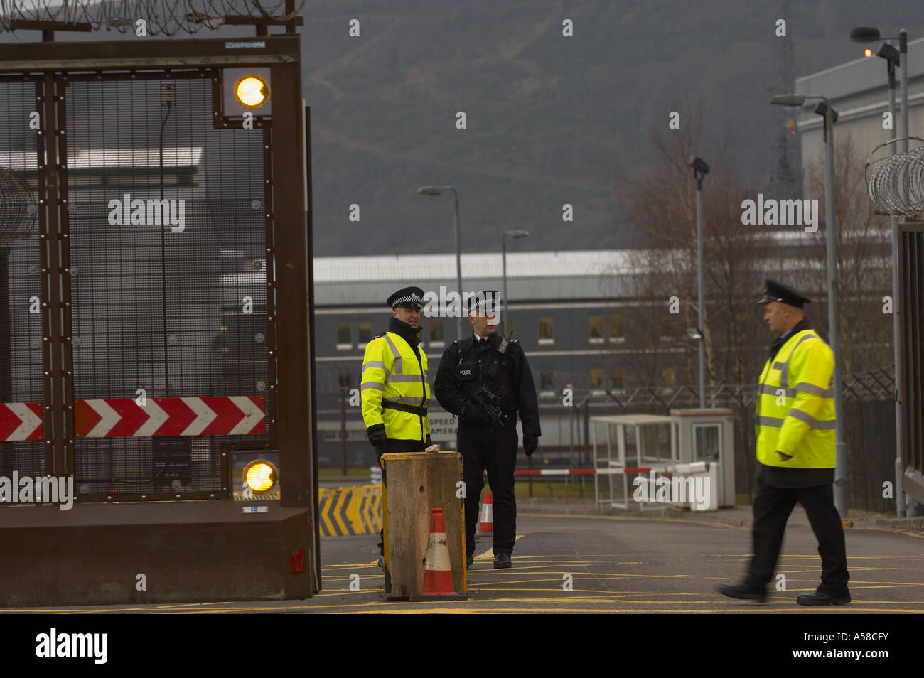 The gate at Faslane Military base closing in front of the protester