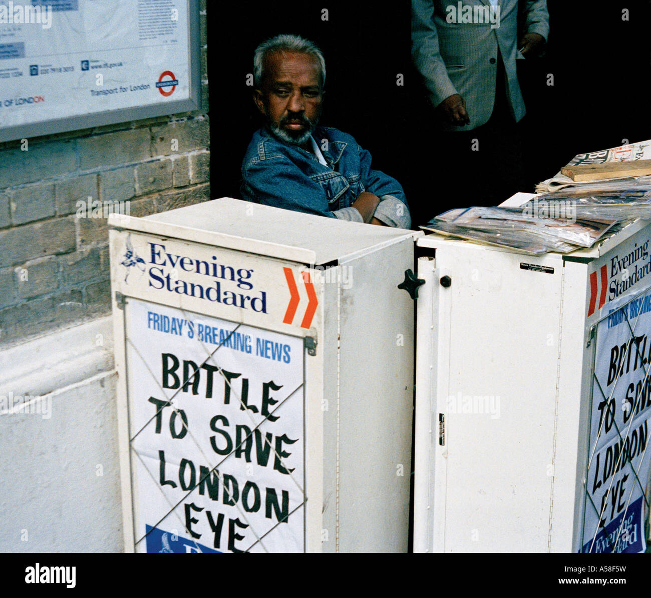 Evening Standard vendor with a broken nose in Whitechapel, East London Stock Photo