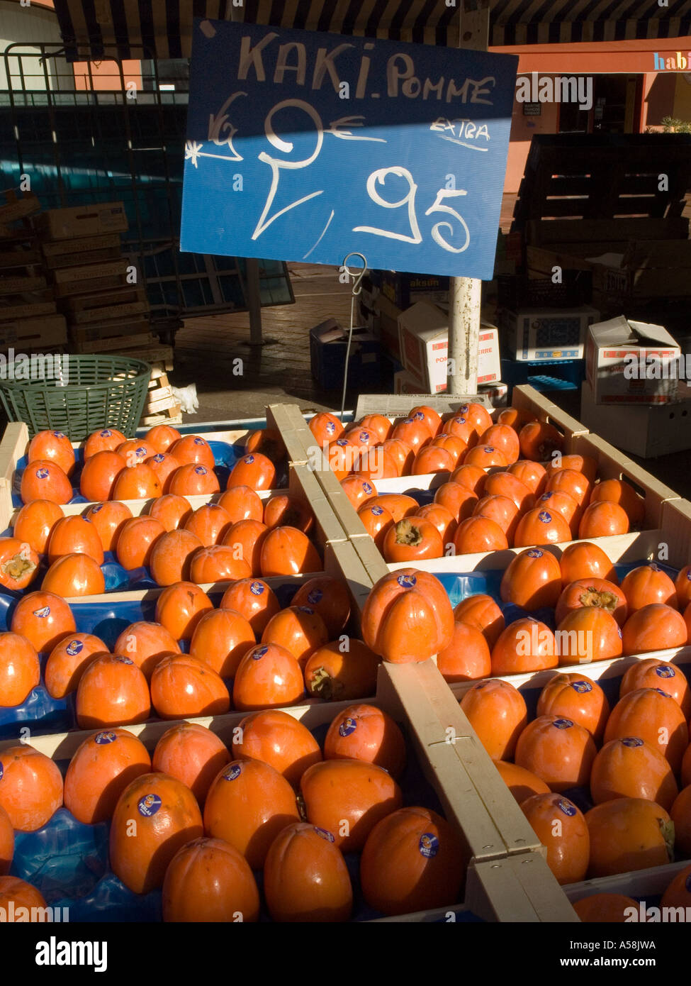 Nice Cote d'Azur France - Kaki pomme is the French name for persimmon, here on sale in a Provencal market Stock Photo