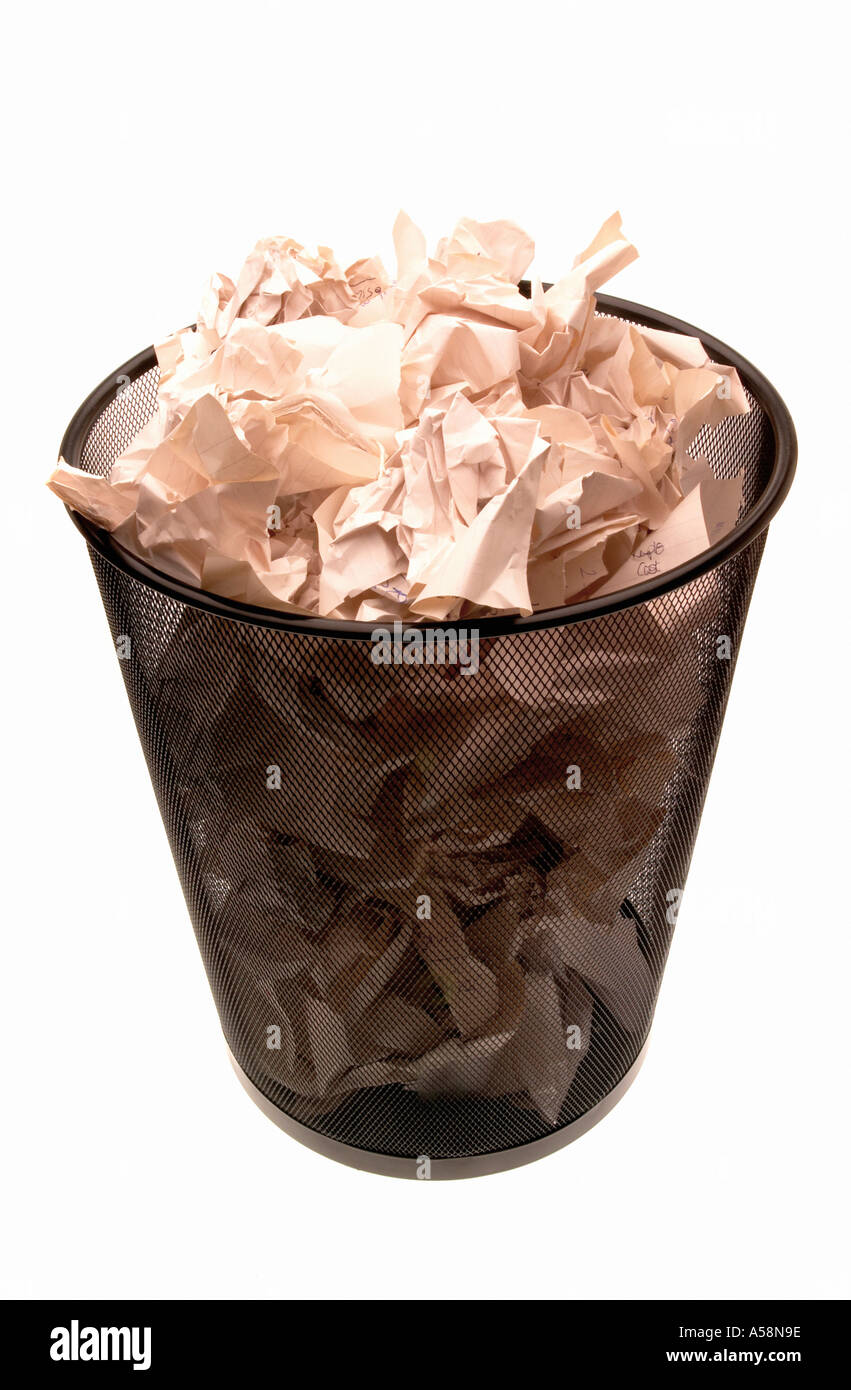 Office trash can full with documents on a white Stock Photo - Alamy