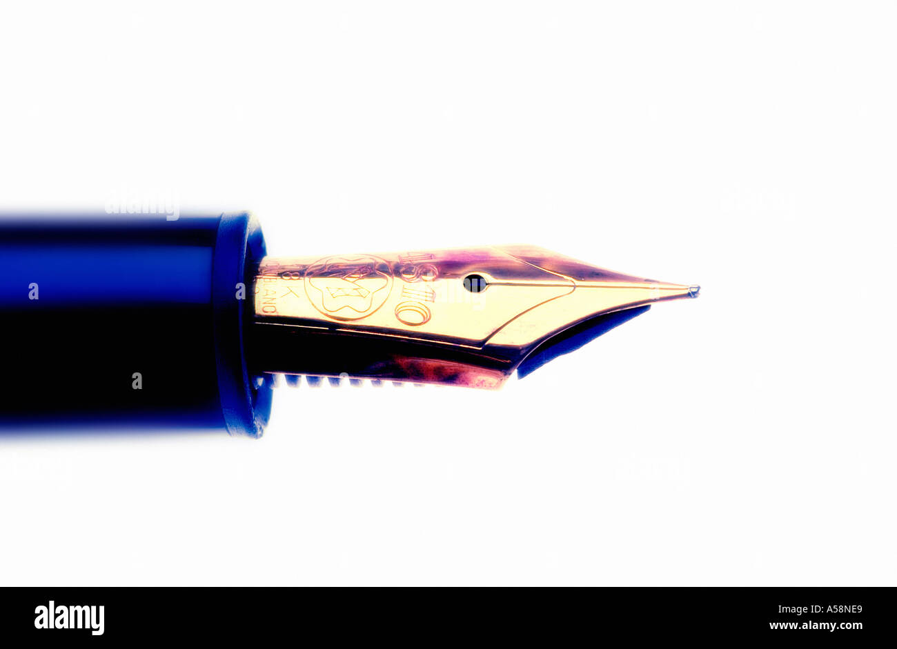 Close-up of the gold nib of a fountain pen against white background Stock Photo