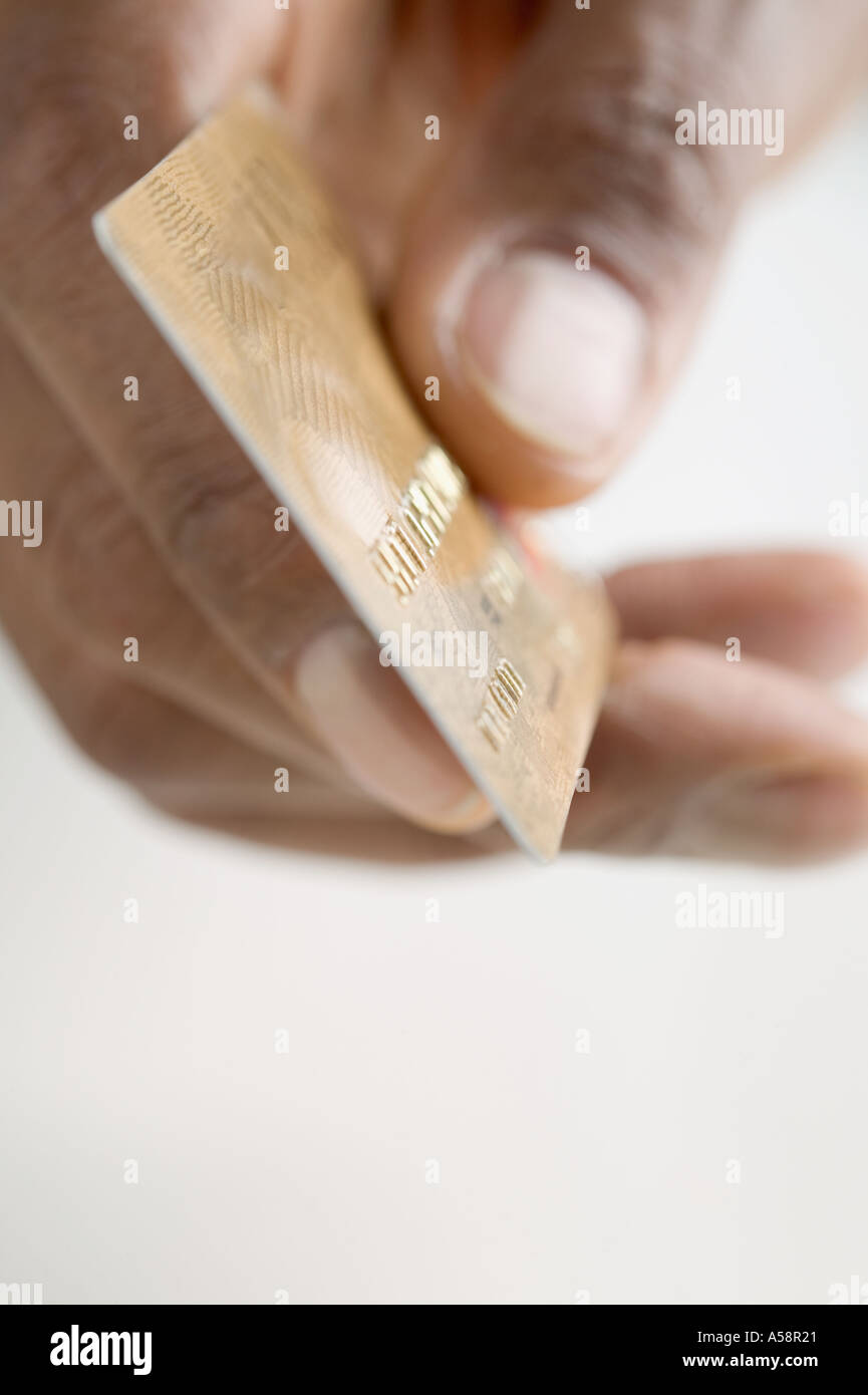 Close up of hand holding credit card Stock Photo