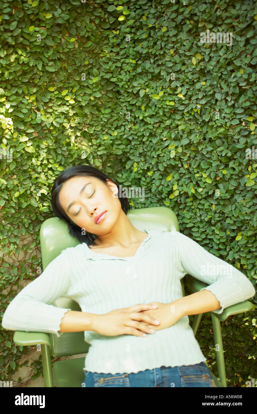 Woman chair eyes closed hi-res stock photography and images - Alamy
