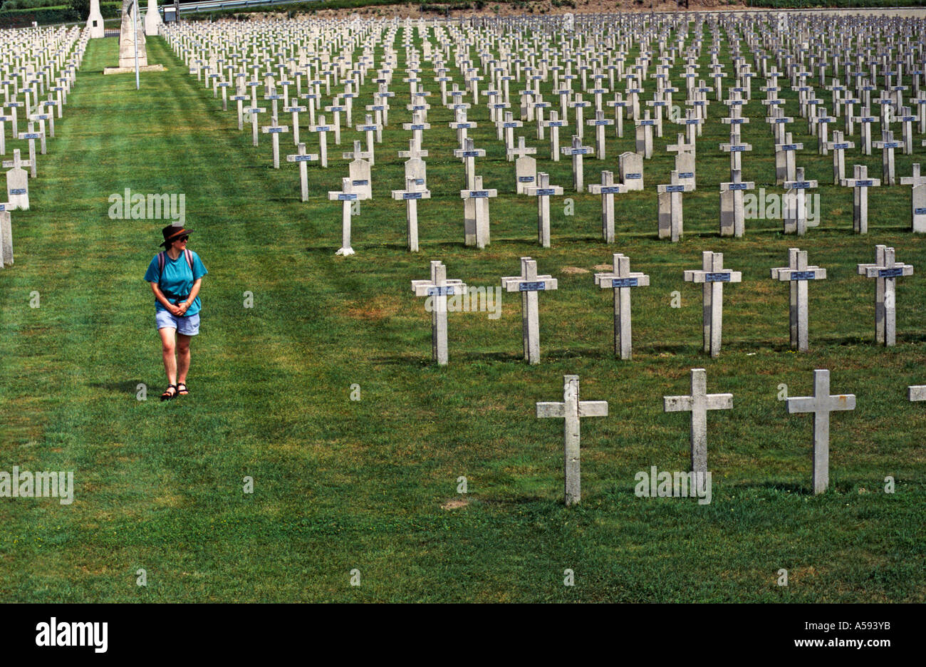 Female walking in First World War French military cemetery Sillery France Stock Photo