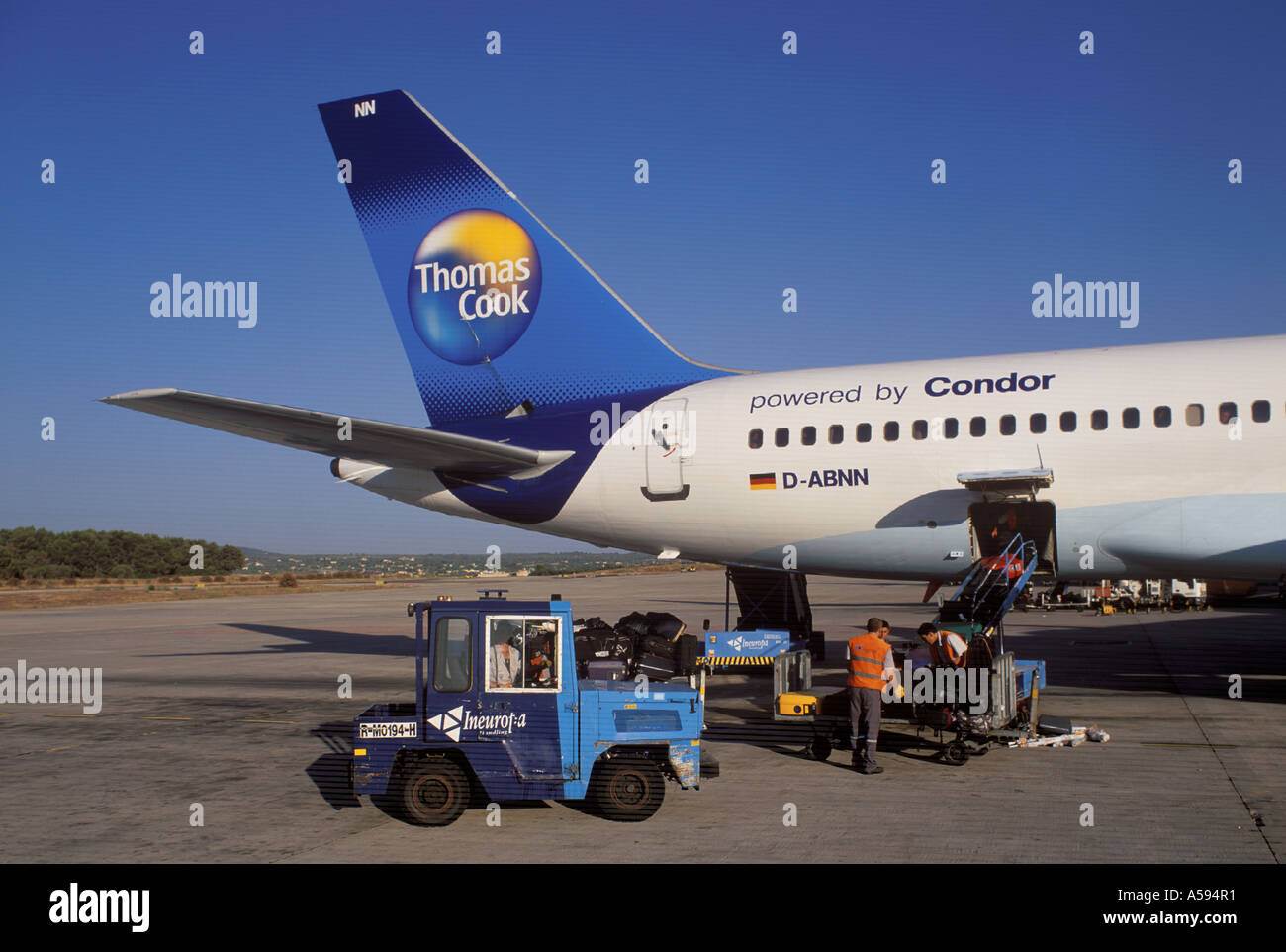 Scene at the Airport of Palma de Mallorca loading luggage onto Thomas Cook Boeing 757 200 reg D ABNN Balearics Spain Stock Photo