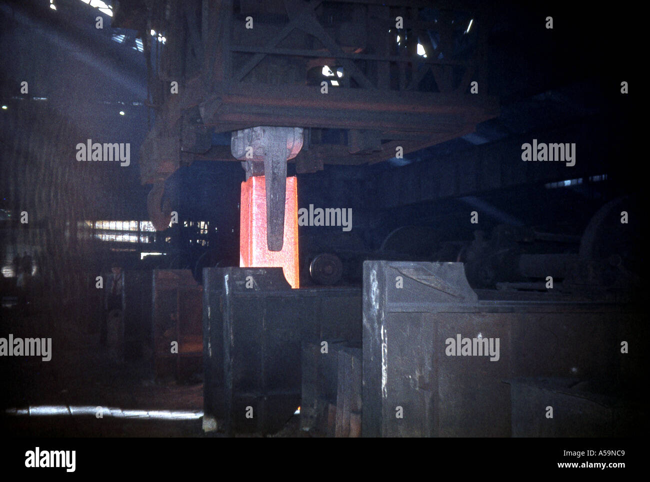 Steel ingot being removed from reheating pit ready for rolling at Lysaghts Scunthorpe works in about 1963 Stock Photo