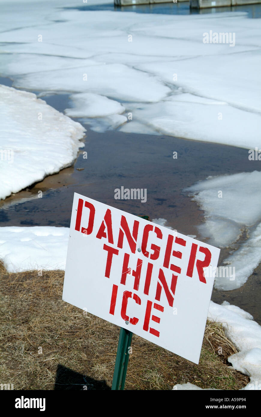 Sign indicating danger thin ice and open water Stock Photo - Alamy
