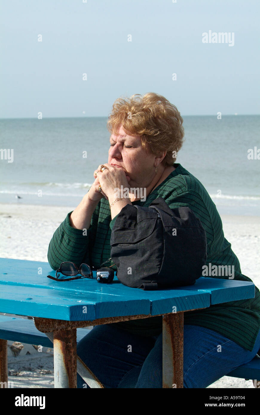 Visitors to St Pete Beach and Pasa Grille Florida engage in exercise relaxation and hobbies while vacationing Stock Photo