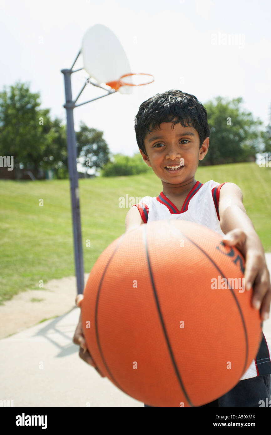 Young boy playing basketball sportswear hires stock photography and