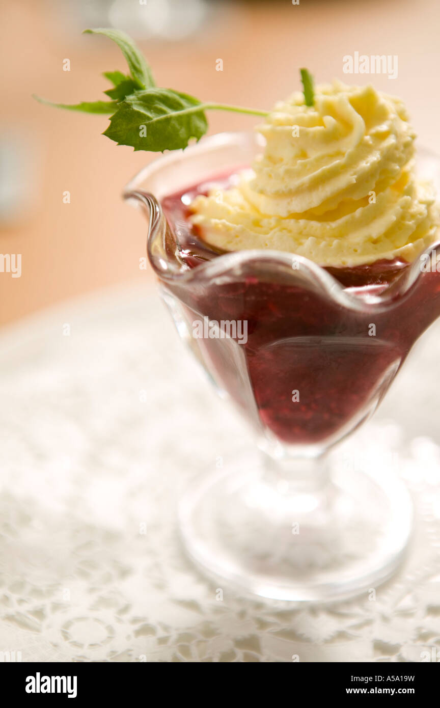 raspberry jelly sundae with cream and mint Stock Photo - Alamy
