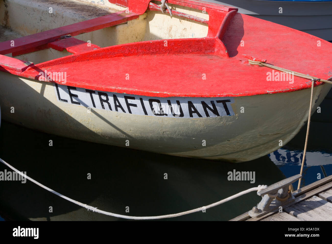 'Le Trafiquant' Red and White boat moored in marina in Réunion Stock Photo