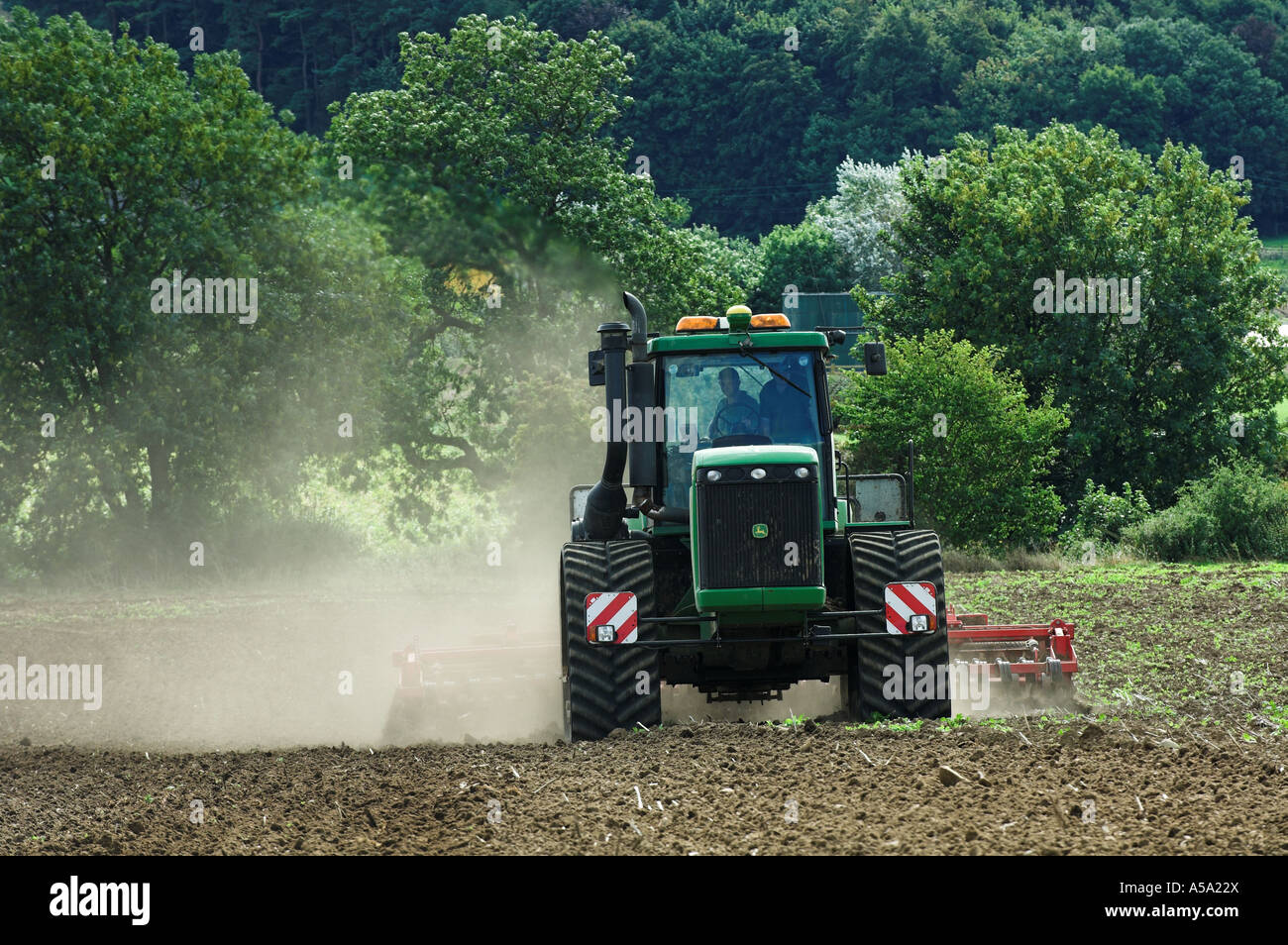 powerful tractor ploughing Stock Photo - Alamy